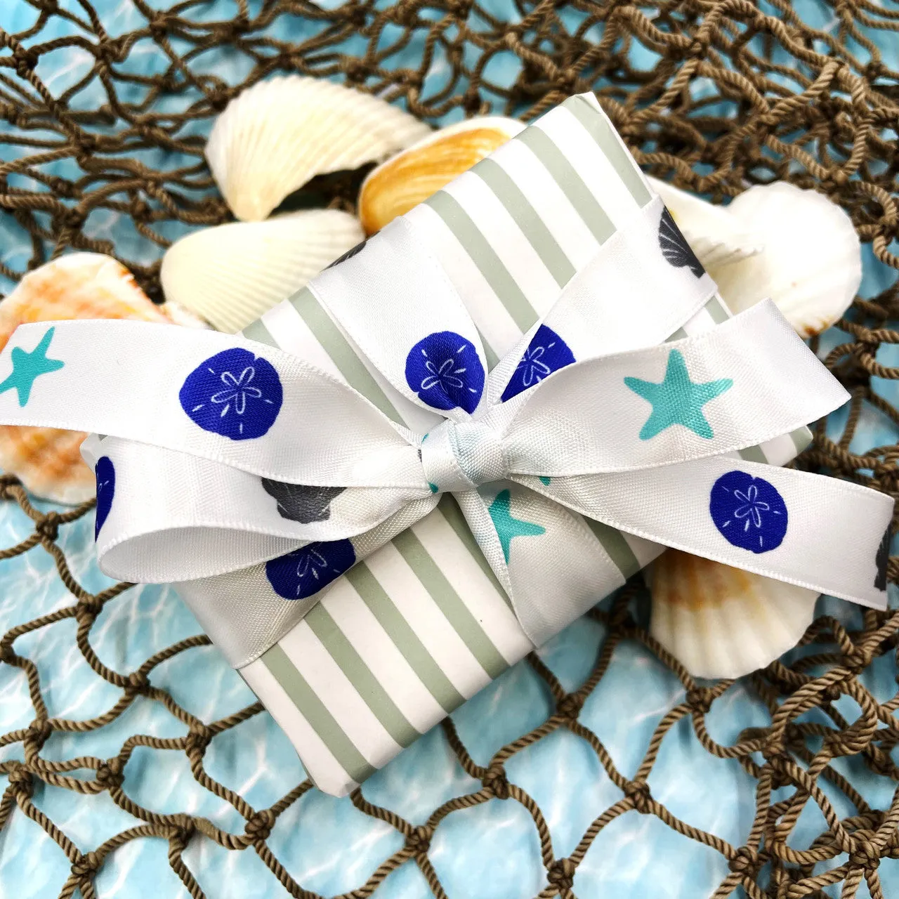 Seashells ribbon with Starfish and Sand Dollars in navy, turquoise and gray printed on 5/8"  white Single Face Satin Ribbon